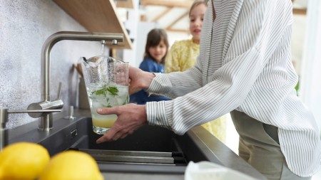 Filling water in a jug at the sink